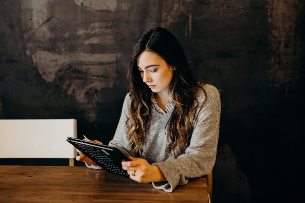 woman looking at options for best paraphrasing tool to beat turnitin