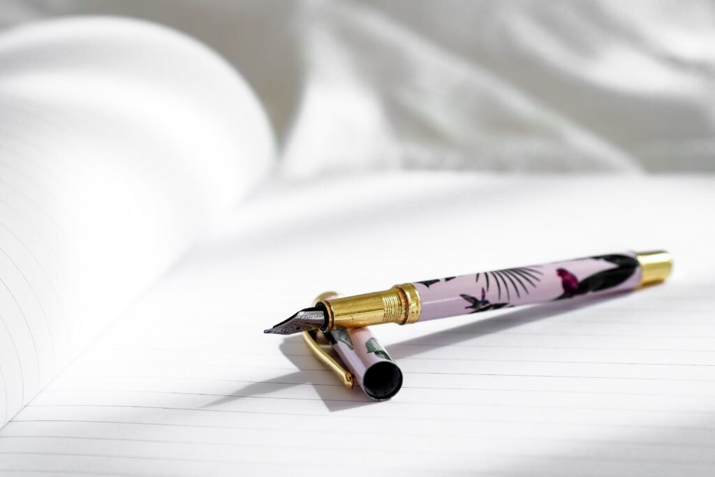 an open pen on a white paper - how to write a persuasive essay