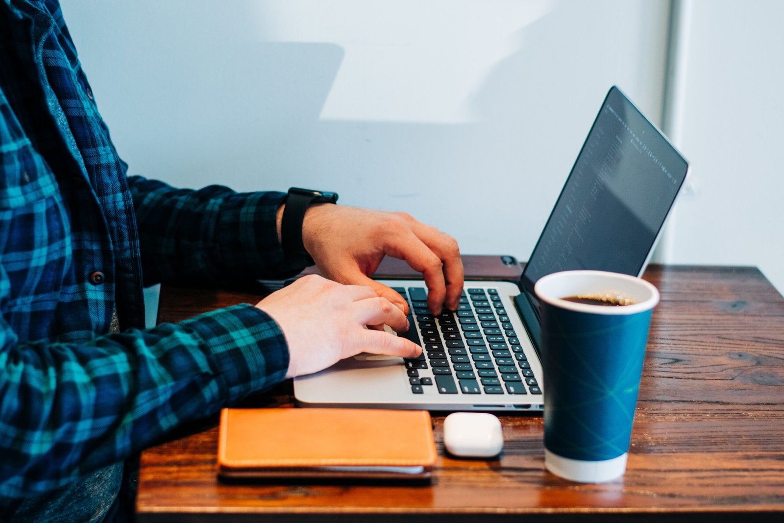 man on laptop using safeassign checker