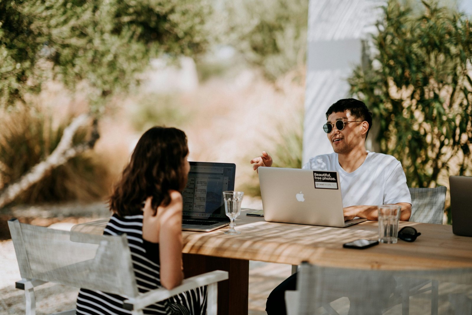 people sitting outdoor and working with Free AI Tools For Research Paper Writing