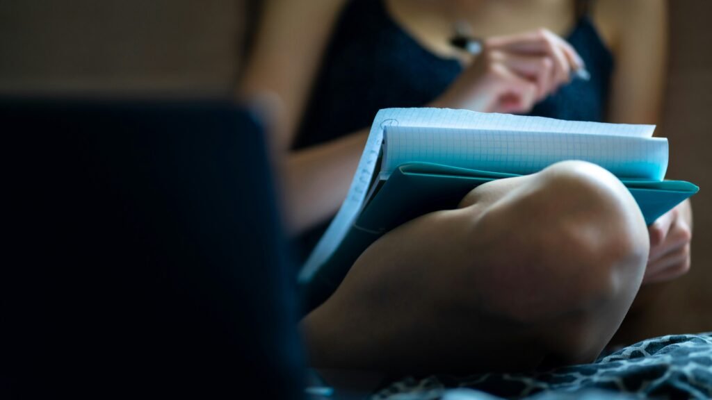 woman making notes from Best SAT Prep Resources