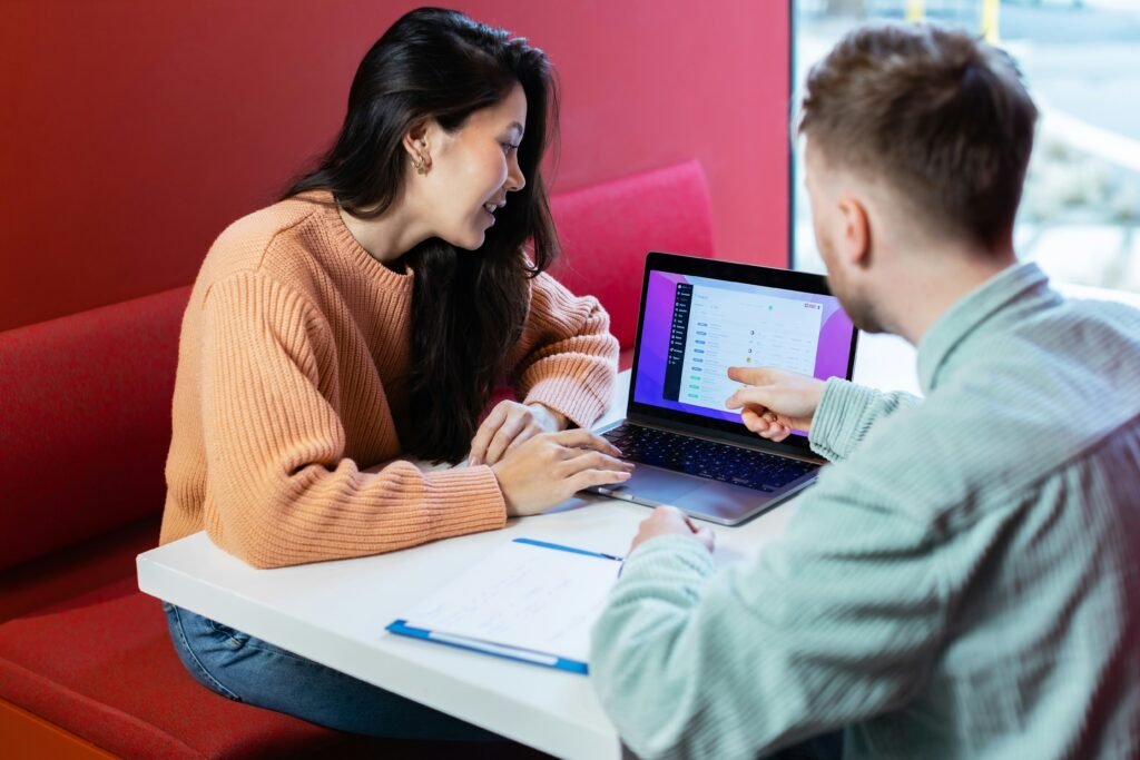 Man Pointing to Laptop for Girl - How To Not Sound Like AI