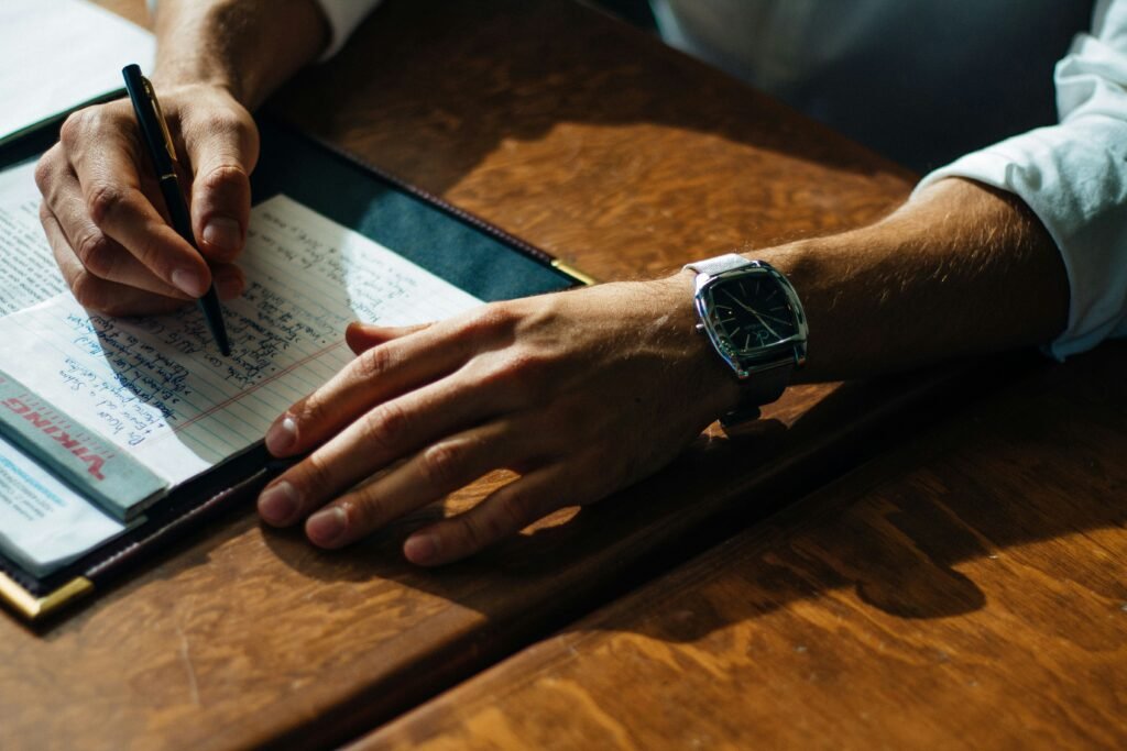 man writing on a copy - SAT Reading And Writing
