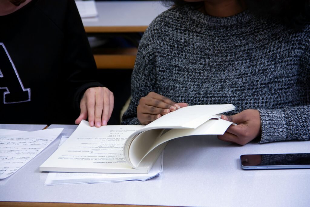 woman checking a copy - SAT Reading And Writing
