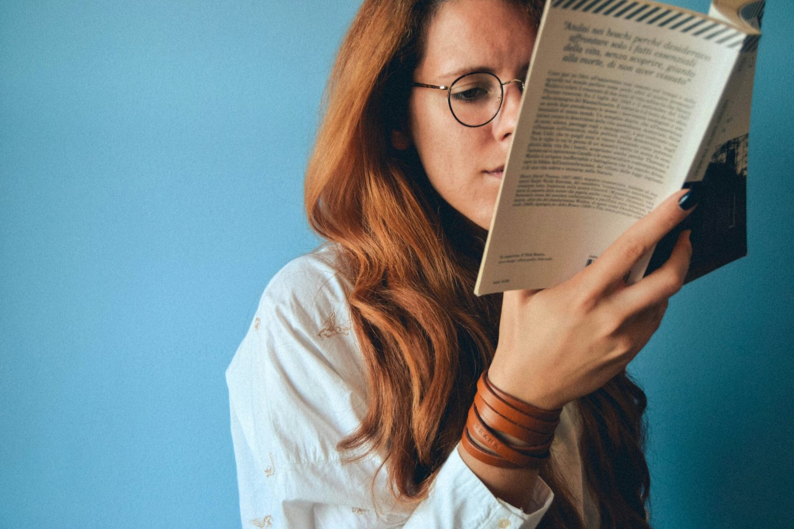 woman reading a book - SAT Vocabulary Flashcard