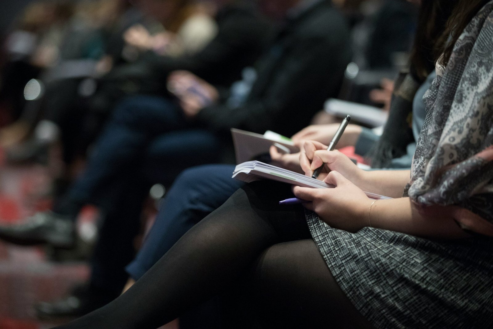 woman making notes in Best SAT Prep Courses