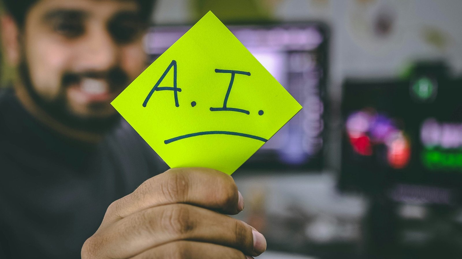 Person Holding a Card on which AI is written - How To Not Sound Like AI