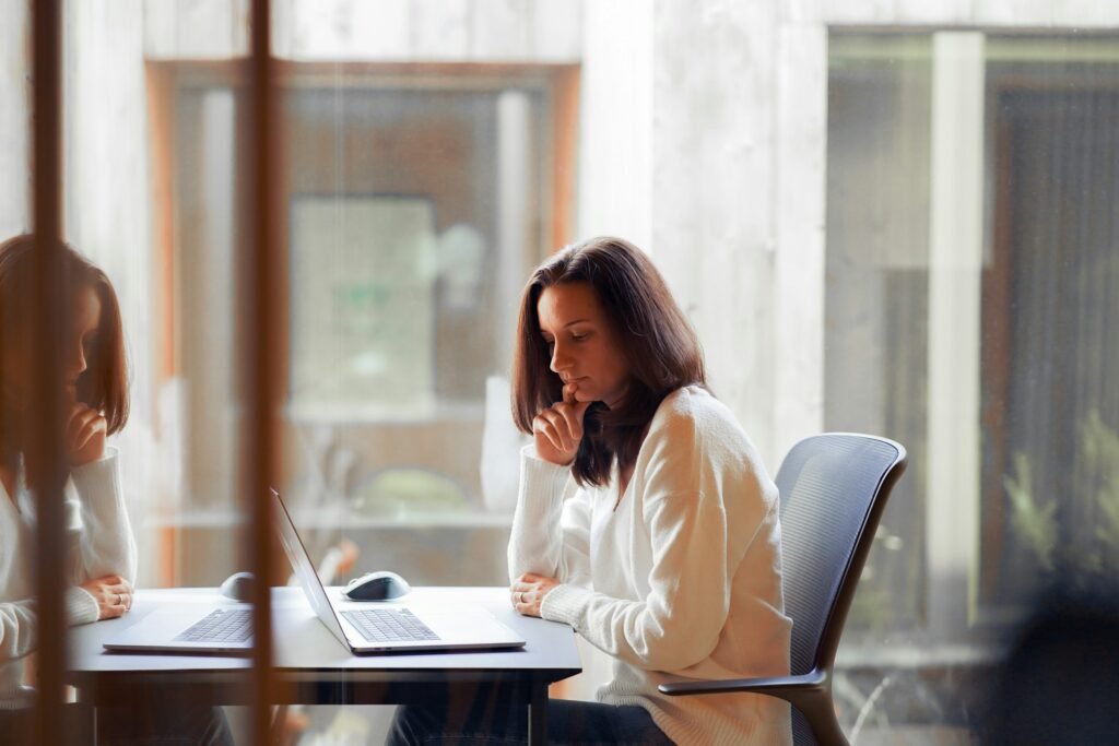 woman with a laptop - Websites Like Jstor