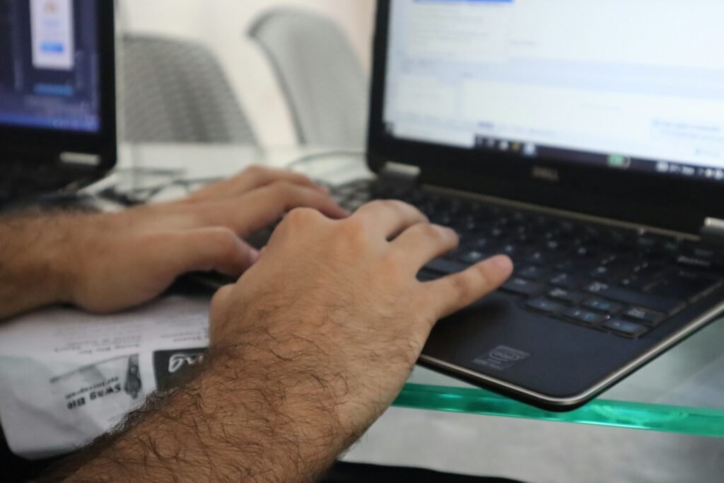 Person Typing on Laptop - How to Calculate H Index