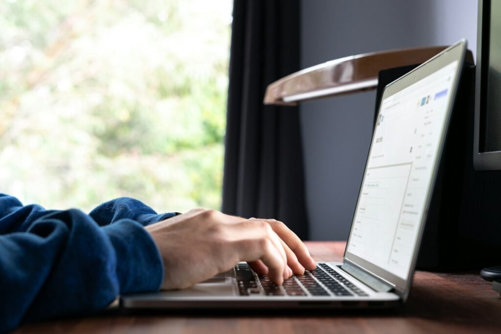 Person Using Laptop - How to Use Ai to Write a Paper
