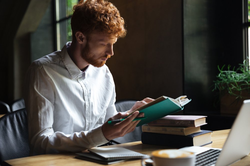 man reading a book - Are Textbooks Primary Sources