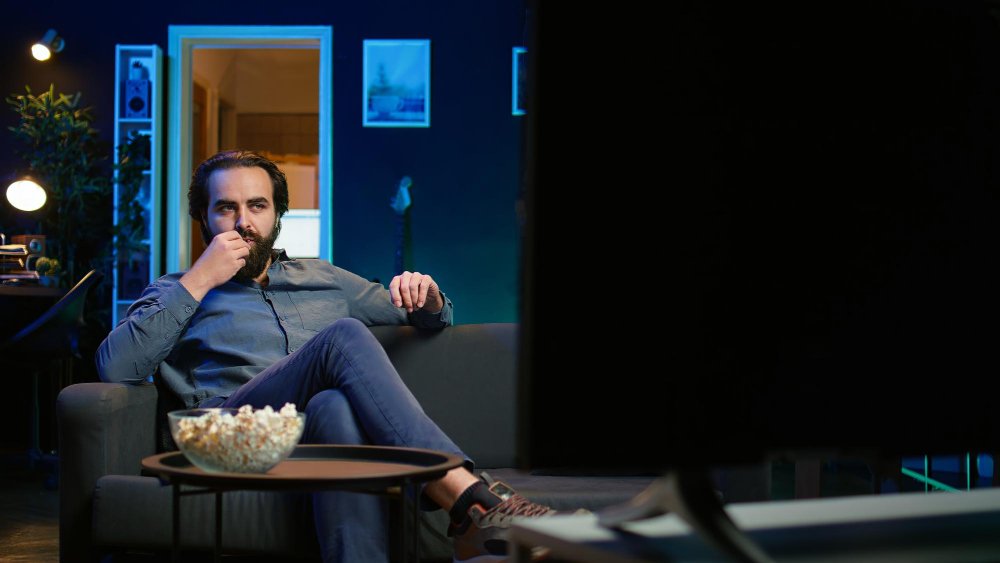 man eating popcorn - Is a Documentary a Primary Source