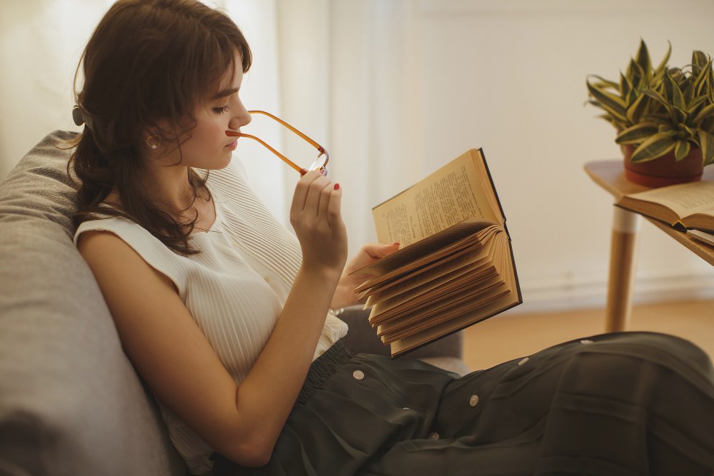 woman sitting on a sofa - Are Textbooks Primary Sources