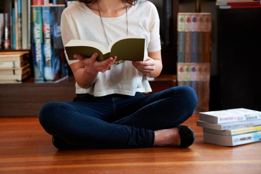 woman in a library - Are Textbooks Primary Sources