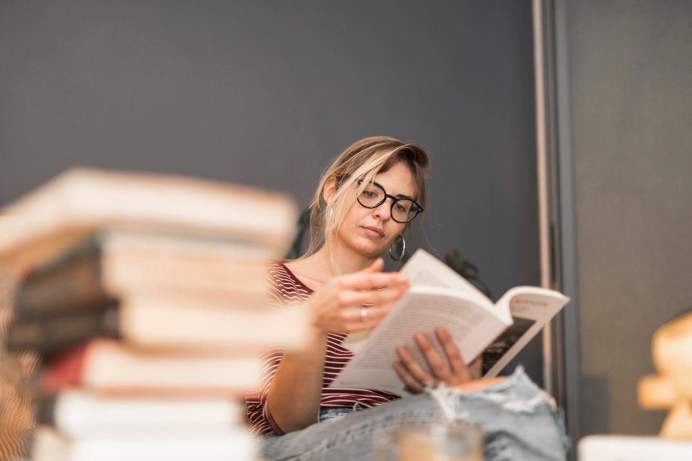woman wearing glasses - Are Textbooks Primary Sources