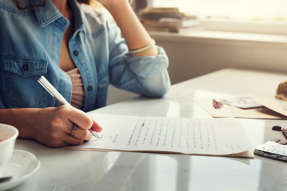 woman writing - Essay About Death