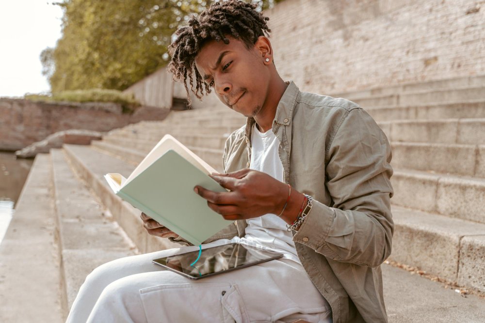 student reading a book - Are Textbooks Primary Sources