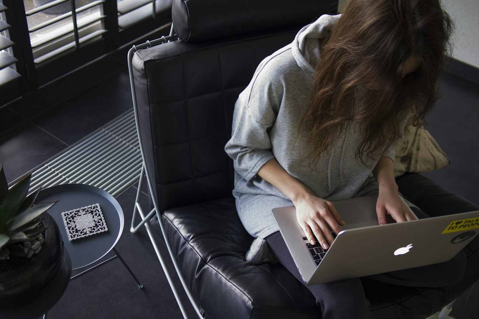 Person Working on Laptop - How to Write a 4-Paragraph Essay