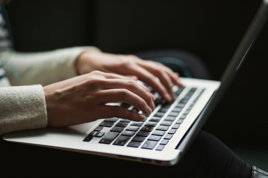 Person Typing on Laptop - Essay on Respect