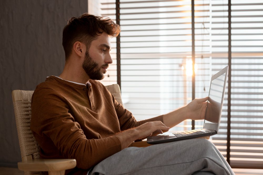 man typing on a laptop - Social Media Argumentative Essay Topics		
