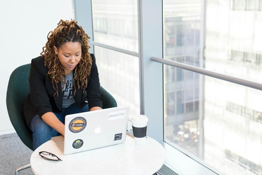 woman using a laptop - National Honor Society Essay Examples		
