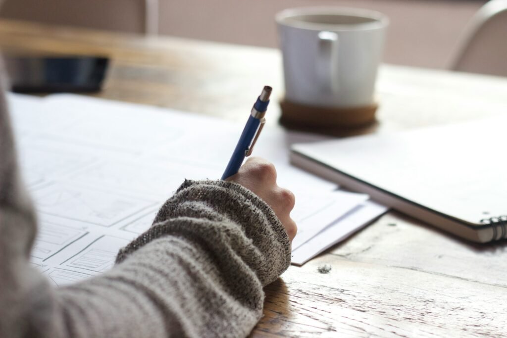 Person Writing - Literary Analysis Essay Examples