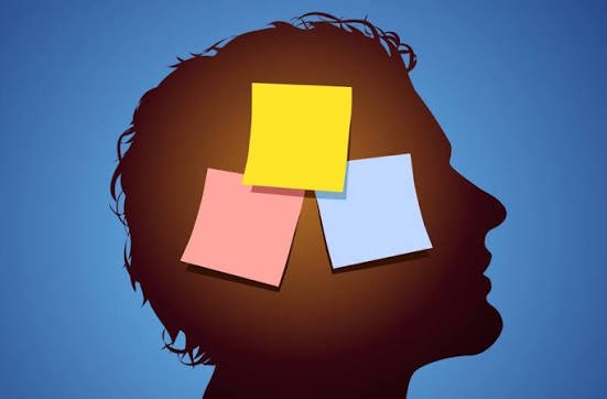 Silhouette of a human head with colorful sticky notes representing memory, learning, and how the brain stores information.